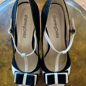 Charming Charlie black and cream shoes with bow